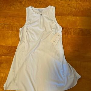 NWT Athleta dress. White size large. Half Zipper in front.